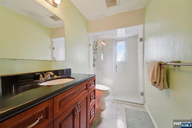 bathroom with vanity, toilet, and walk in shower