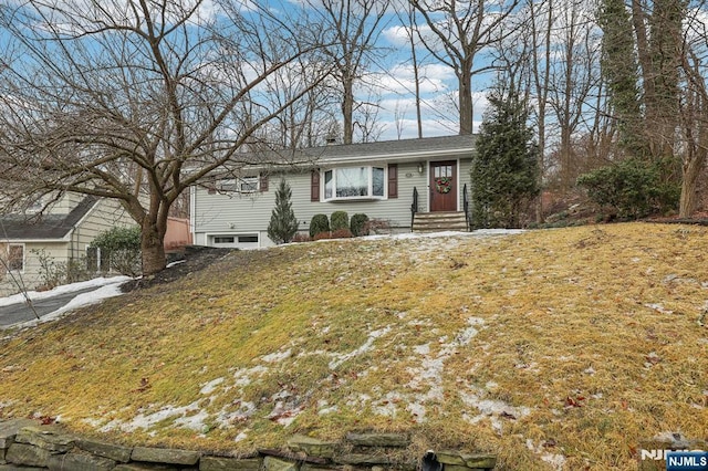 ranch-style home with a front lawn