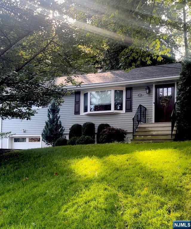 ranch-style house with a front lawn