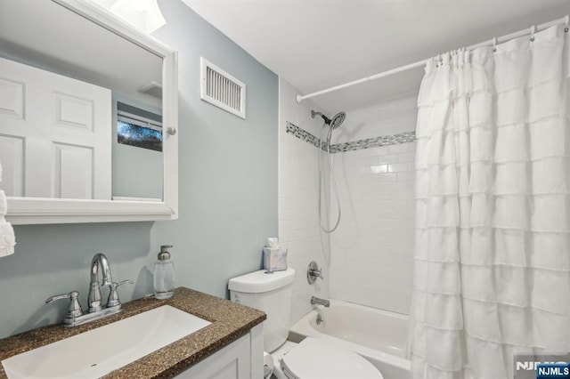 full bath featuring toilet, shower / tub combo, vanity, and visible vents