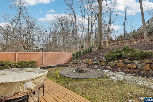 view of yard featuring fence and a wooden deck