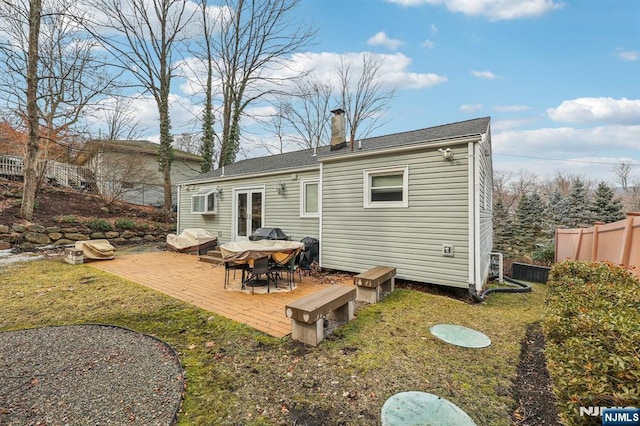 back of property featuring a patio, fence, a yard, french doors, and a chimney