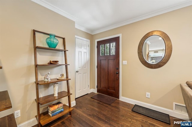 entryway with ornamental molding, dark wood-style flooring, visible vents, and baseboards