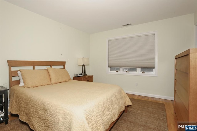 bedroom featuring dark hardwood / wood-style floors