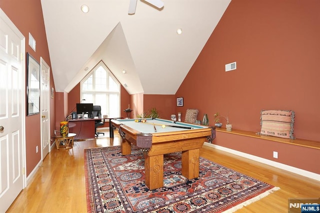 game room with billiards, vaulted ceiling, and hardwood / wood-style floors