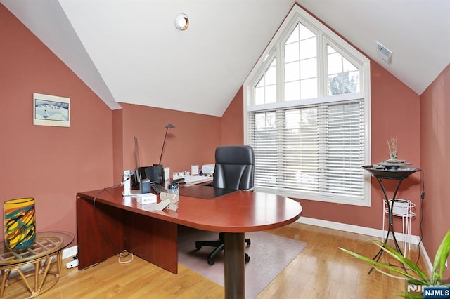 office featuring light hardwood / wood-style flooring and lofted ceiling