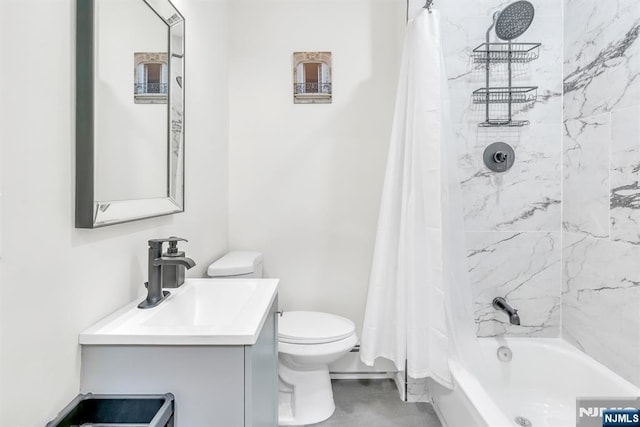 full bathroom featuring shower / bath combo, vanity, and toilet