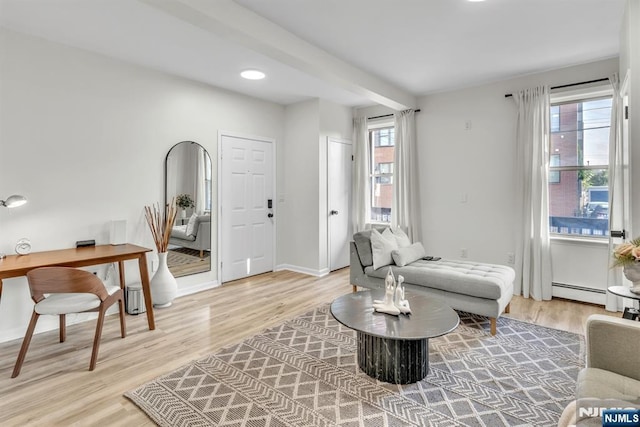 sitting room with light hardwood / wood-style flooring and baseboard heating