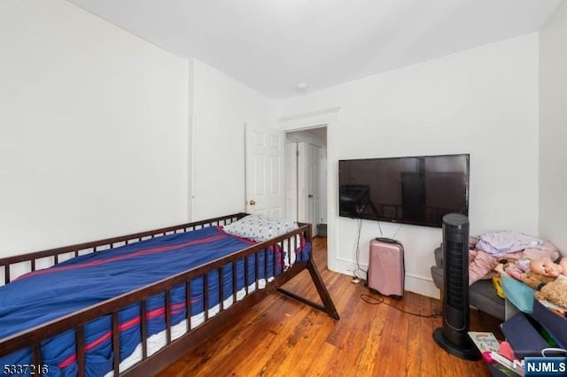 bedroom featuring wood-type flooring