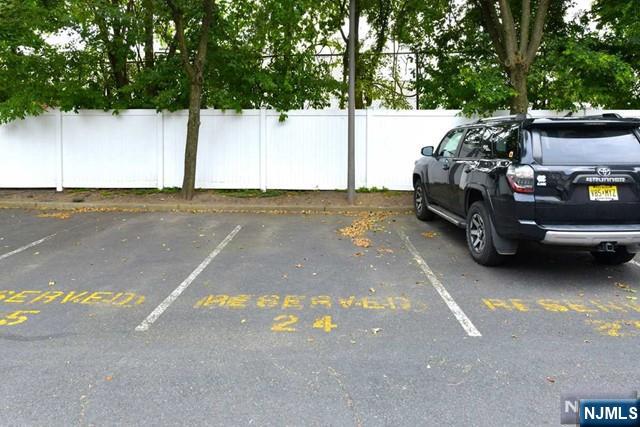 uncovered parking lot with fence