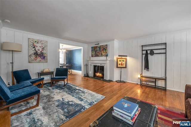 living room featuring hardwood / wood-style flooring and a chandelier