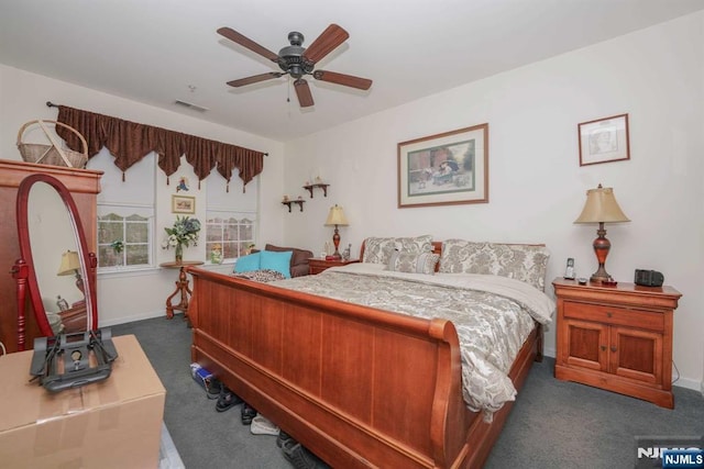 carpeted bedroom with ceiling fan