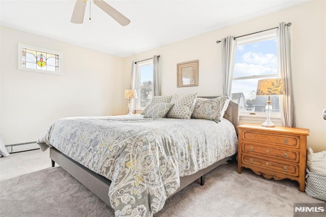 bedroom featuring a baseboard radiator, a ceiling fan, and light colored carpet