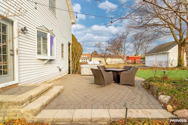 view of patio with outdoor dining area and fence