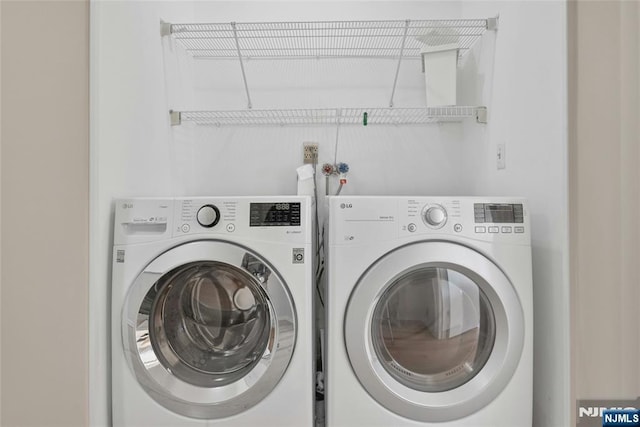 laundry area with laundry area and washing machine and dryer