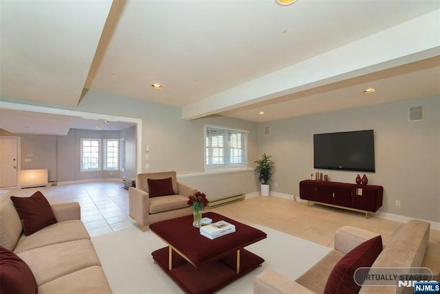 tiled living room featuring a baseboard heating unit