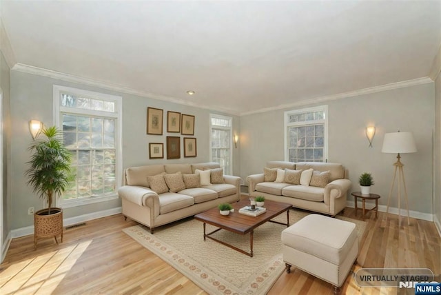 living room with crown molding and light hardwood / wood-style floors