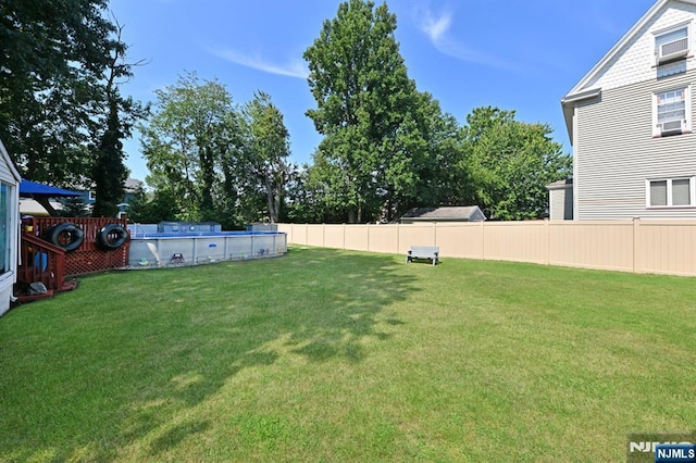 view of yard featuring a fenced backyard and a fenced in pool