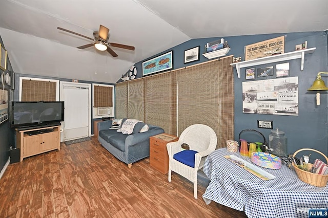 living area featuring lofted ceiling, ceiling fan, and wood finished floors