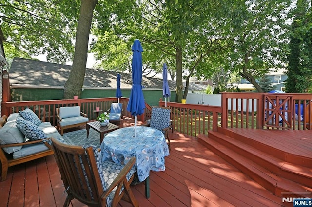 wooden deck with outdoor lounge area