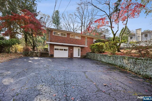 view of property exterior featuring a garage