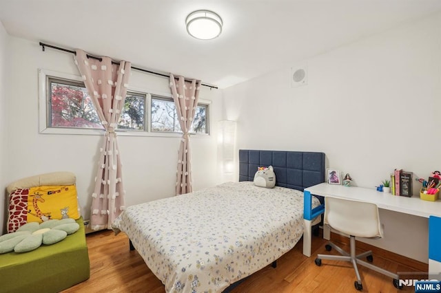 bedroom featuring hardwood / wood-style floors