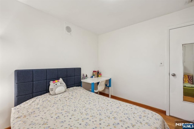 bedroom featuring hardwood / wood-style flooring