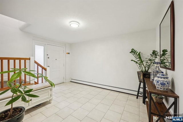 tiled entryway with a baseboard heating unit