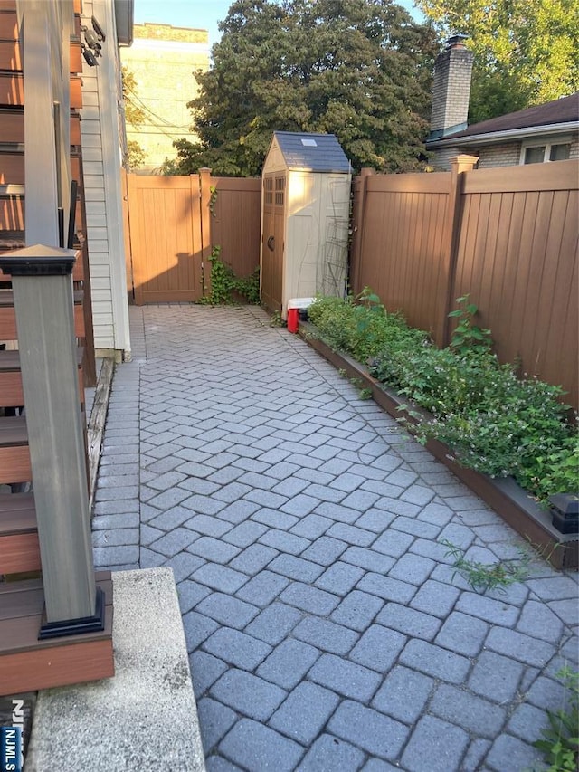 view of patio / terrace with a shed