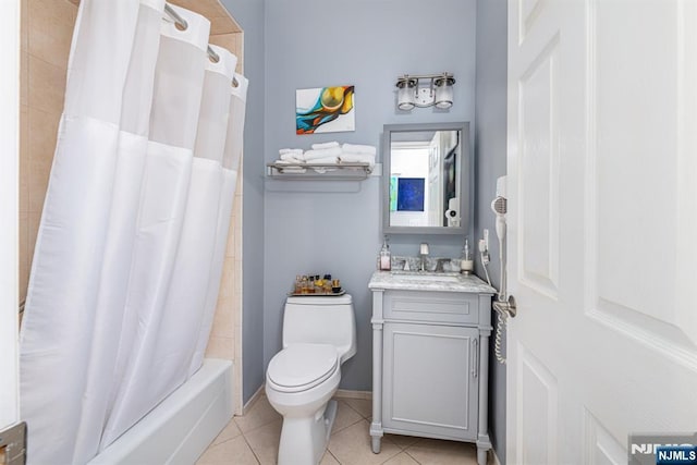 full bathroom featuring toilet, tile patterned flooring, shower / tub combo with curtain, and vanity