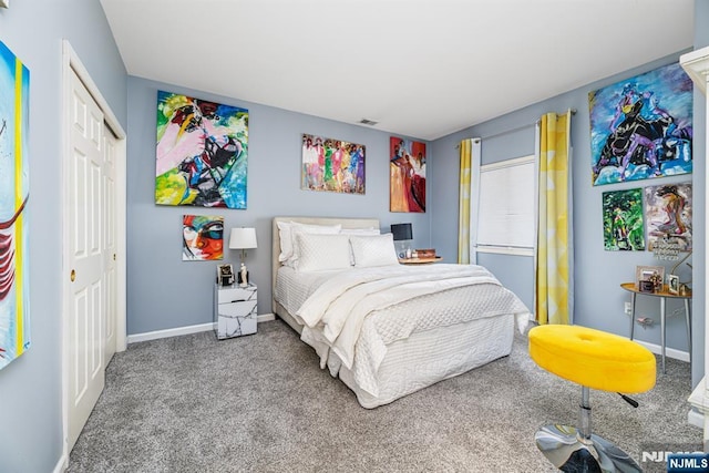 carpeted bedroom with a closet