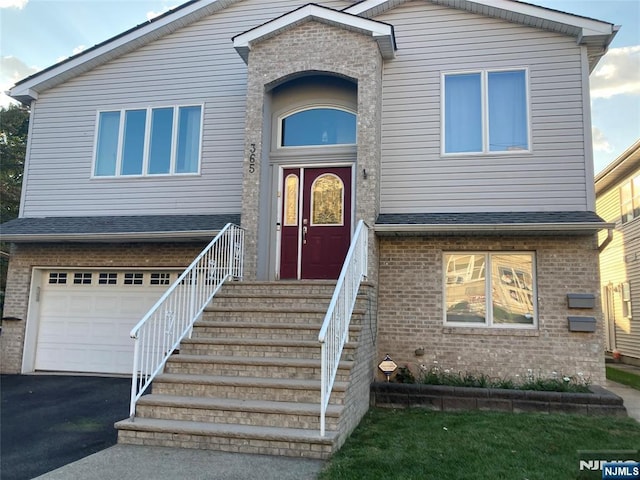 view of front of property with a garage