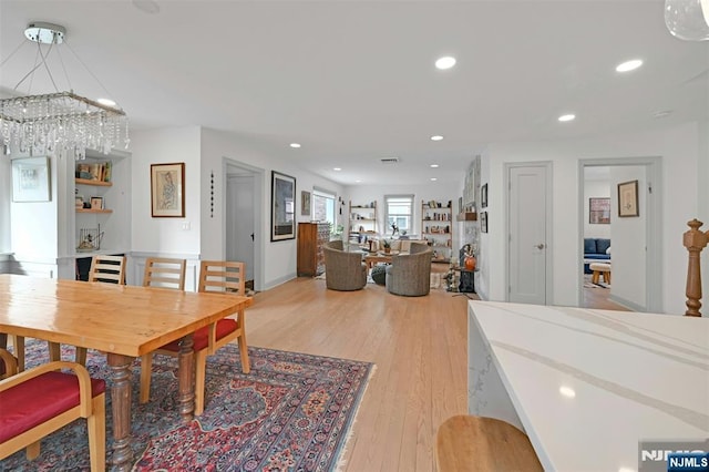 dining space featuring recessed lighting and light wood-style floors