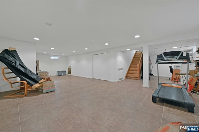 workout area featuring light tile patterned floors and recessed lighting