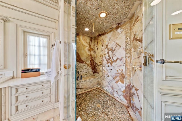 bathroom with a tile shower