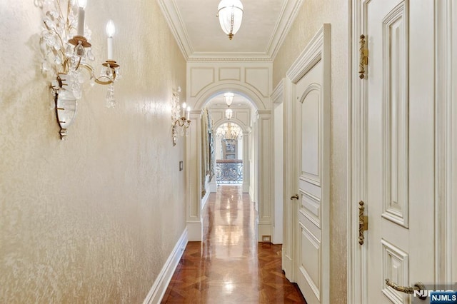 corridor with ornamental molding and dark parquet flooring