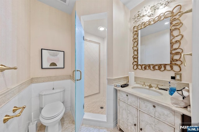 bathroom with tile patterned floors, vanity, toilet, and walk in shower