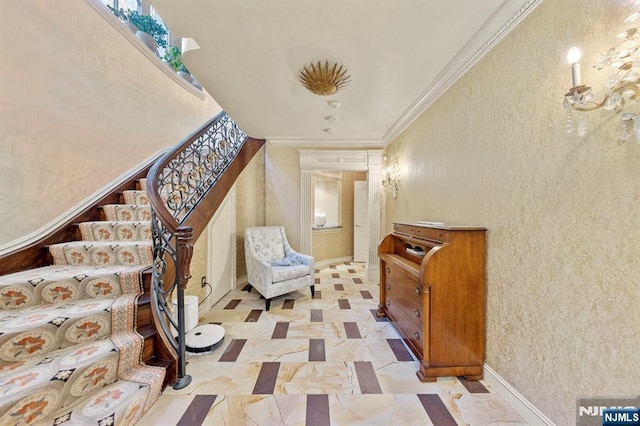 stairway featuring ornamental molding