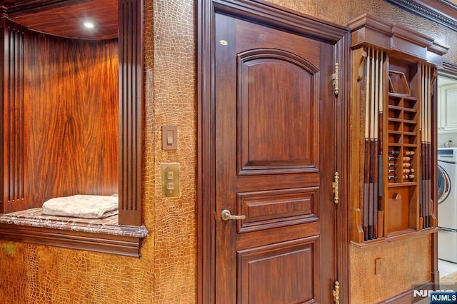 room details featuring elevator and washer / dryer