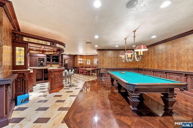 game room with pool table, crown molding, and light parquet flooring