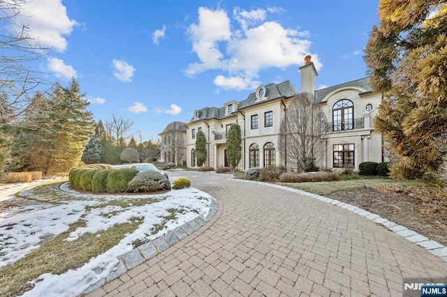 french country inspired facade featuring french doors