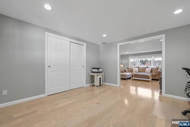 interior space with visible vents, recessed lighting, light wood-style flooring, and baseboards