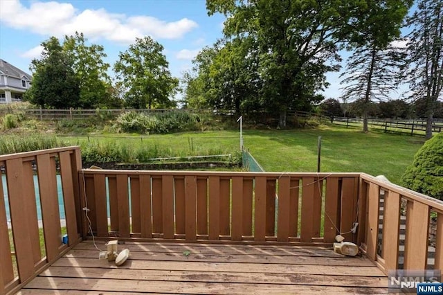 deck featuring a lawn