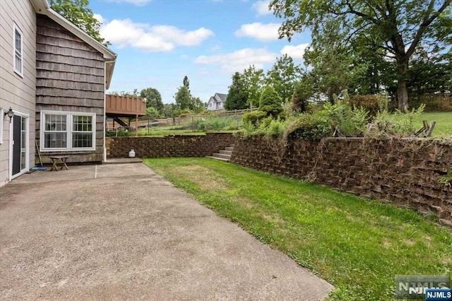 view of yard with a patio area