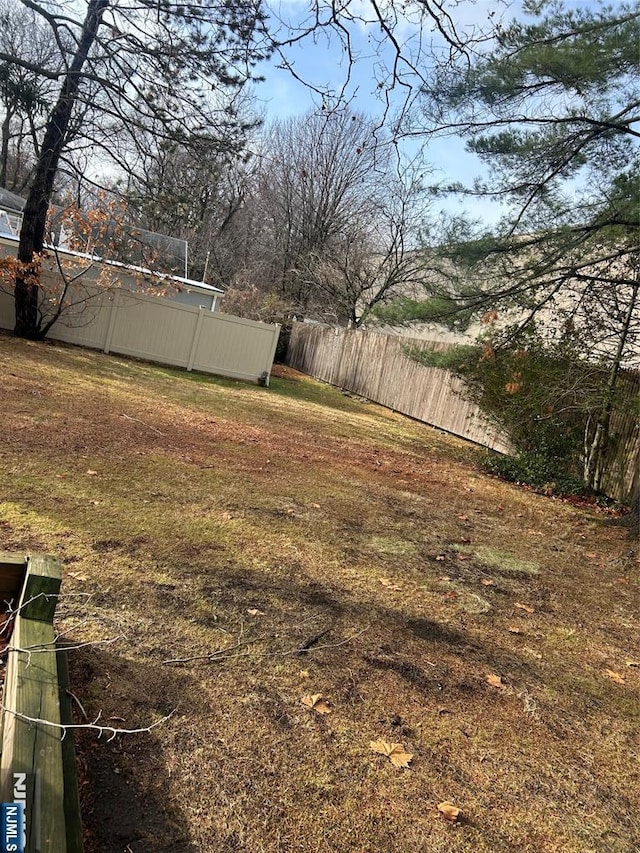 view of yard with fence