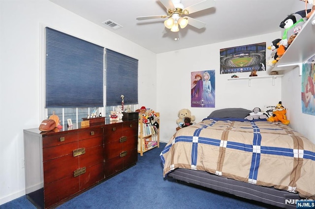 bedroom featuring carpet floors, visible vents, and a ceiling fan