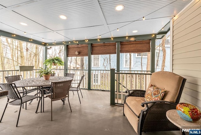 sunroom / solarium with rail lighting