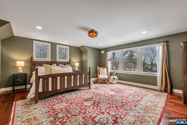 bedroom featuring baseboards, wood finished floors, and recessed lighting