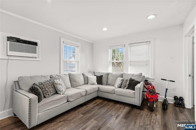 living room featuring a wall mounted AC, dark wood-type flooring, and crown molding