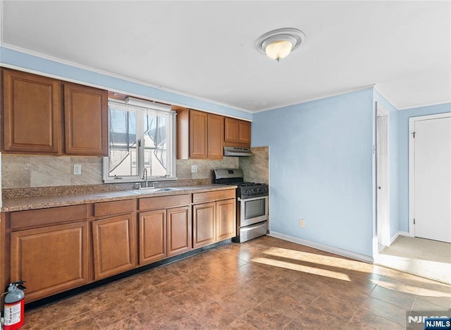 kitchen featuring sink, crown molding, tasteful backsplash, and stainless steel range with gas stovetop